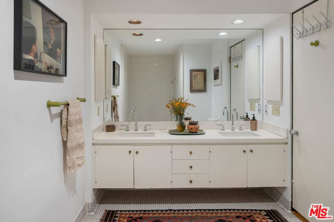 4520 Dundee Drive Los Angeles, CA 90027 - Photo 35 of 63 a bathroom with a sink and a mirror
