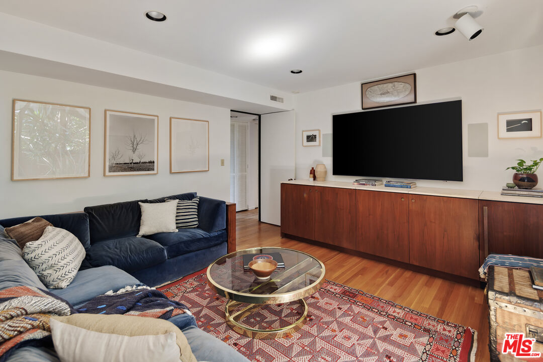 4520 Dundee Drive Los Angeles, CA 90027 - Photo 45 of 63 a living room with furniture and a flat screen tv