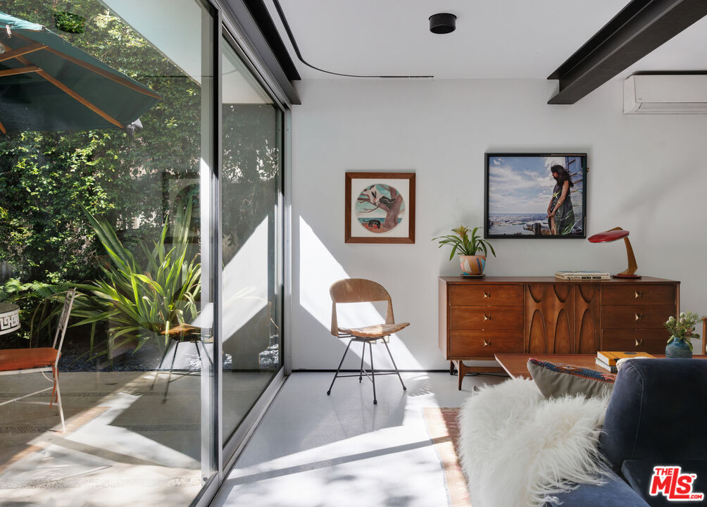 4520 Dundee Drive Los Angeles, CA 90027 - Photo 49 of 63 a living room with furniture and a potted plant