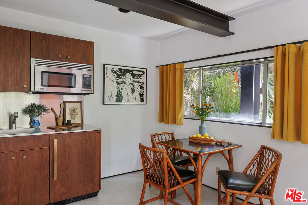 4520 Dundee Drive Los Angeles, CA 90027 - Photo 51 of 63 a view of a dining room with furniture window and outside view