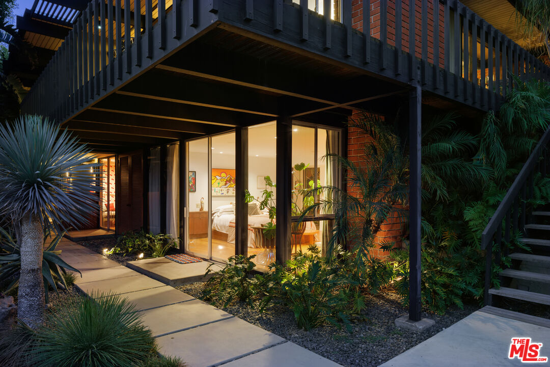 4520 Dundee Drive Los Angeles, CA 90027 - Photo 58 of 63 a view of swimming pool with lawn chairs and plants