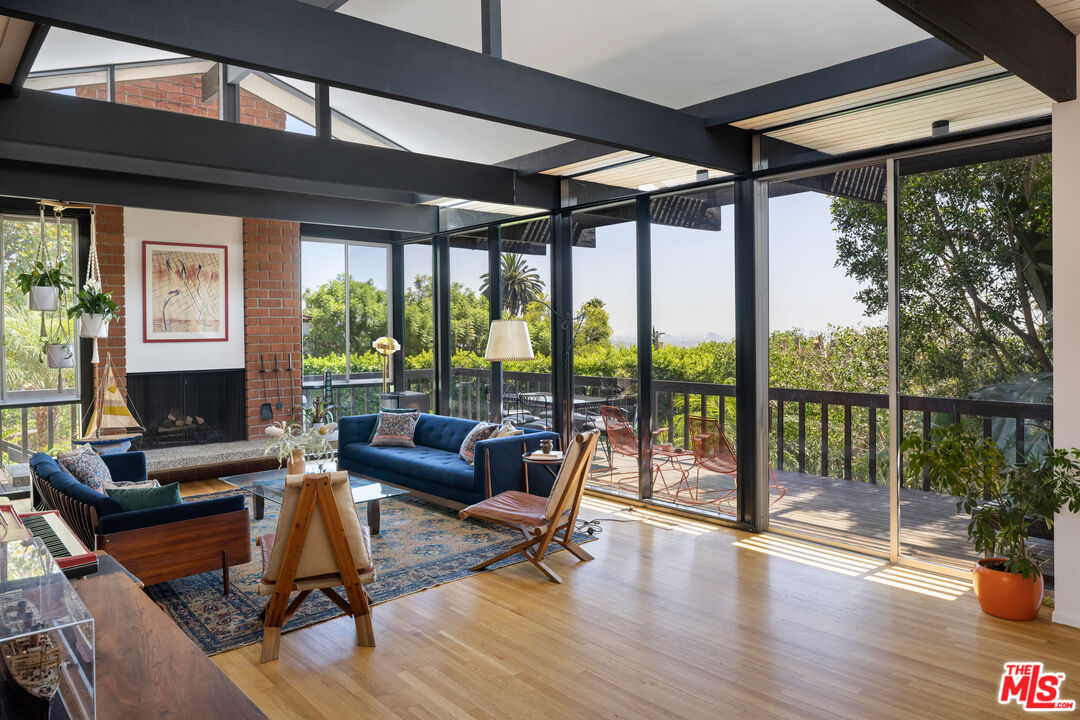 4520 Dundee Drive Los Angeles, CA 90027 - Photo 9 of 63 a living room with furniture and a fireplace
