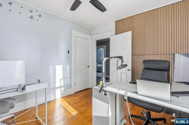 a bedroom with a bed and a desk