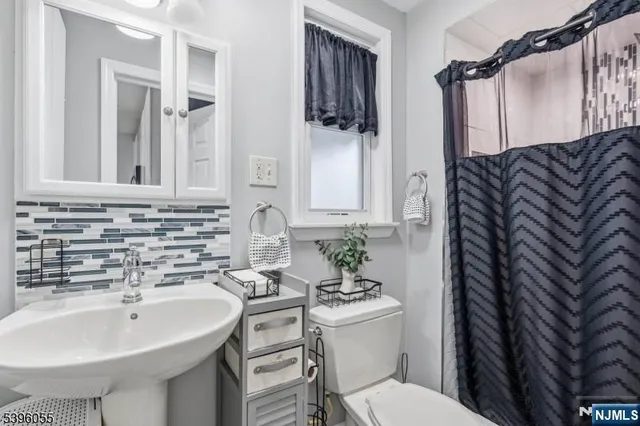 a bedroom with bed and a window