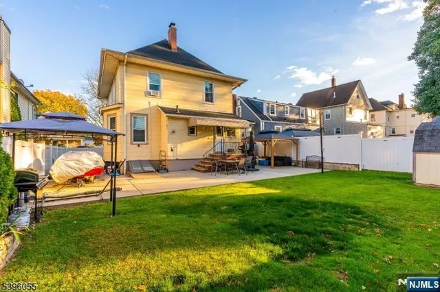 a view of a backyard with sitting area
