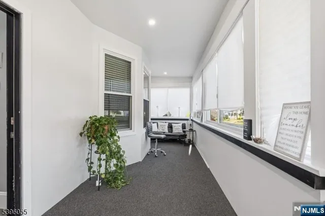 a view of a room with window and furniture