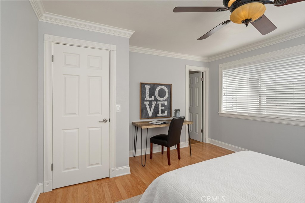 8683 Sullivan Way Durham, CA 95938 - Photo 22 of 32 a bedroom with a bed and a chandelier