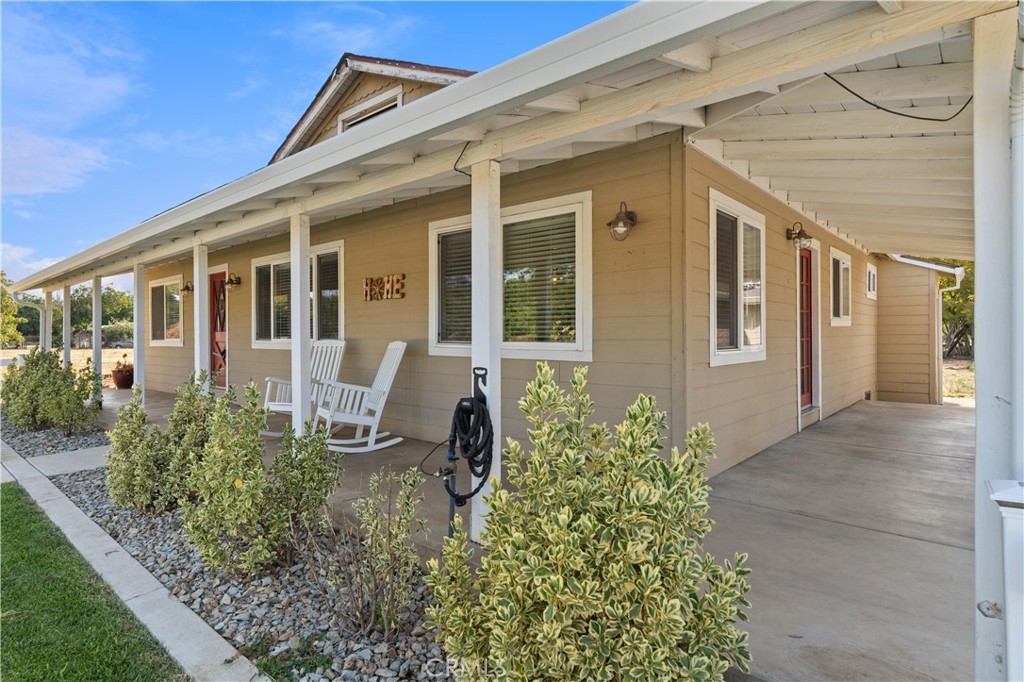 8683 Sullivan Way Durham, CA 95938 - Photo 5 of 32 front view of a house with a yard