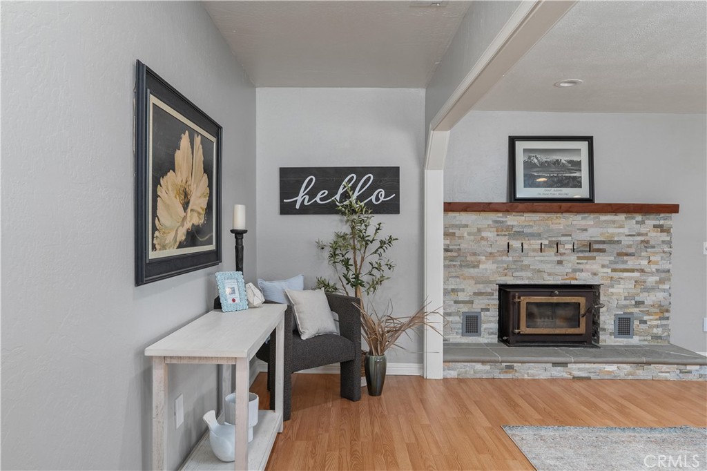 8683 Sullivan Way Durham, CA 95938 - Photo 7 of 32 a living room with furniture and a fireplace
