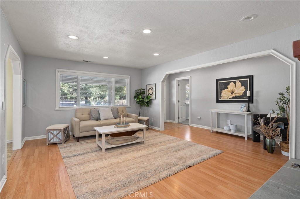 8683 Sullivan Way Durham, CA 95938 - Photo 8 of 32 a living room with furniture and a wooden floor