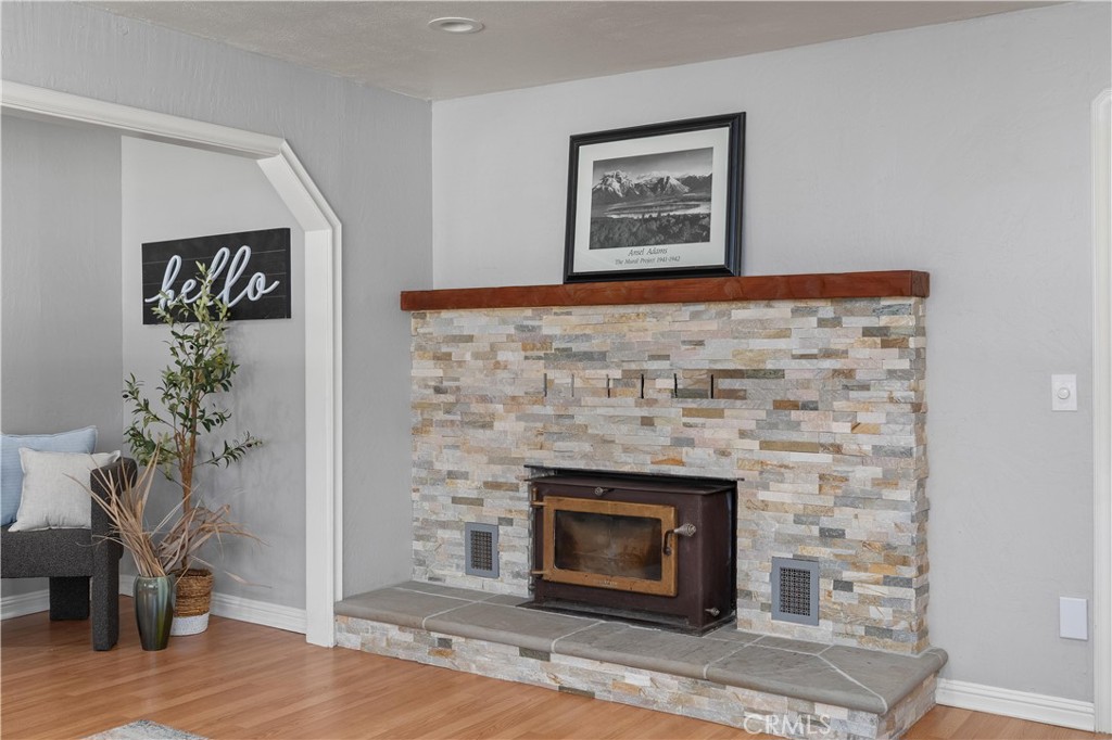 8683 Sullivan Way Durham, CA 95938 - Photo 10 of 32 a living room with furniture and a fireplace