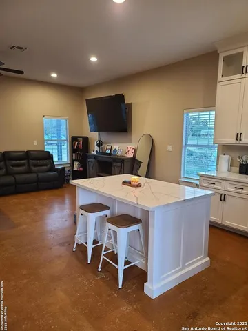 a kitchen with a sink appliances and cabinets