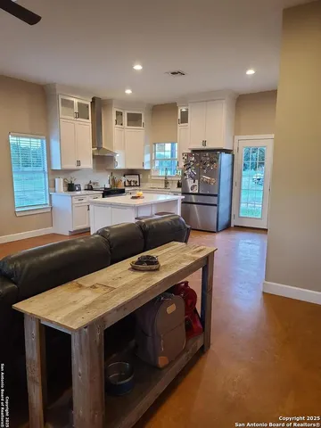 a kitchen with a stove and a refrigerator