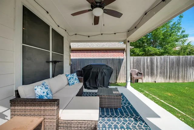 a living room with couch and a fireplace
