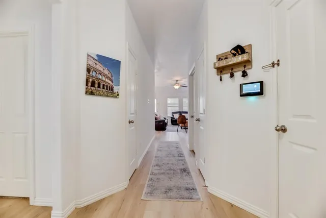 a view of a hallway with the wooden floor
