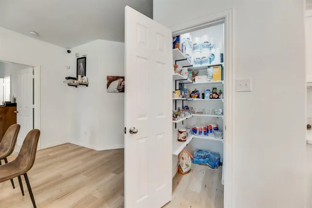a room with a book shelf and a couch