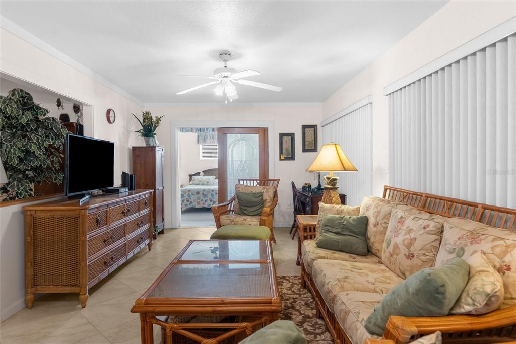 6409 Wedgewood Drive Spring Hill, FL 34606 - Photo 16 of 38 a living room with furniture and a flat screen tv