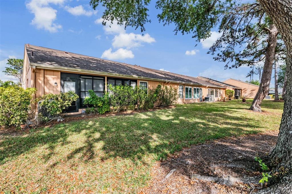 9302 Trowbridge Court New Port Richey, FL 34655 - Photo 29 of 41 a front view of a house with garden