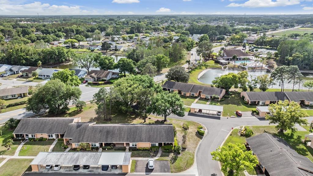 9302 Trowbridge Court New Port Richey, FL 34655 - Photo 36 of 41 an aerial view of multiple houses with yard