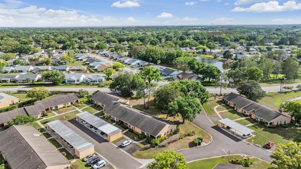 9302 Trowbridge Court New Port Richey, FL 34655 - Photo 37 of 41 an aerial view of a city with lots of residential buildings ocean and mountain view in back
