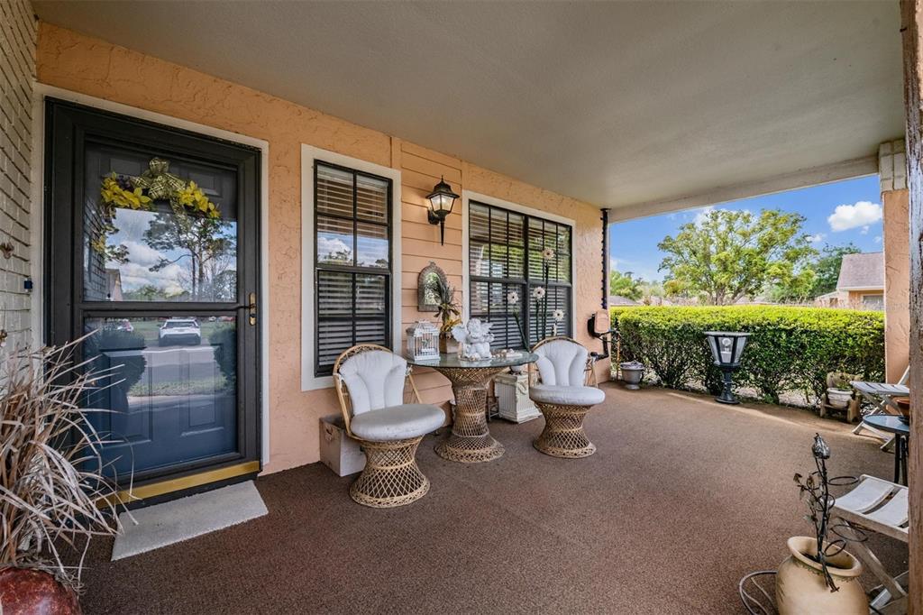 9302 Trowbridge Court New Port Richey, FL 34655 - Photo 4 of 41 a living room with furniture and a floor to ceiling window