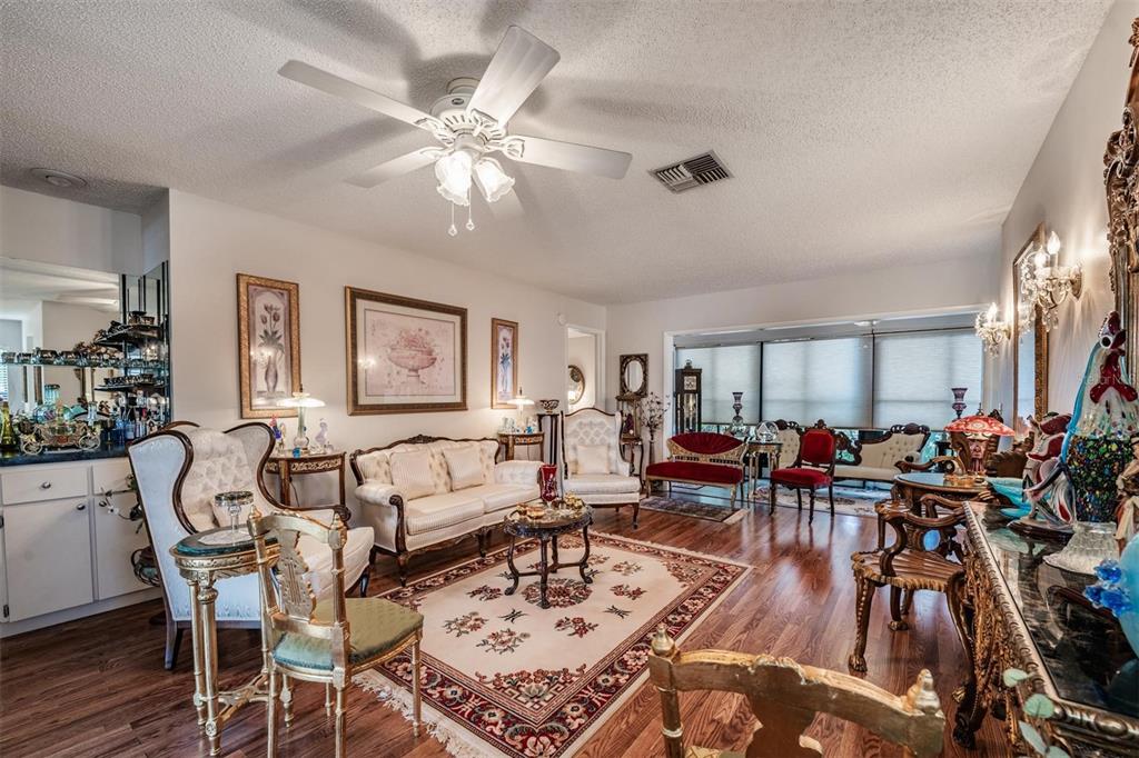 9302 Trowbridge Court New Port Richey, FL 34655 - Photo 9 of 41 a living room with furniture and a large window