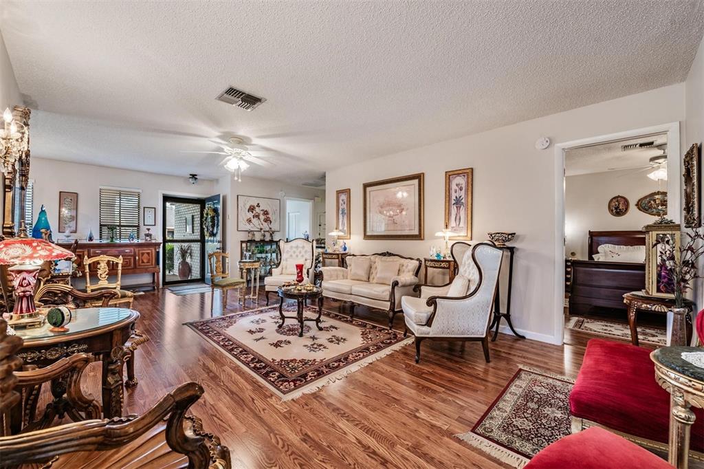 9302 Trowbridge Court New Port Richey, FL 34655 - Photo 10 of 41 a living room with furniture and wooden floor