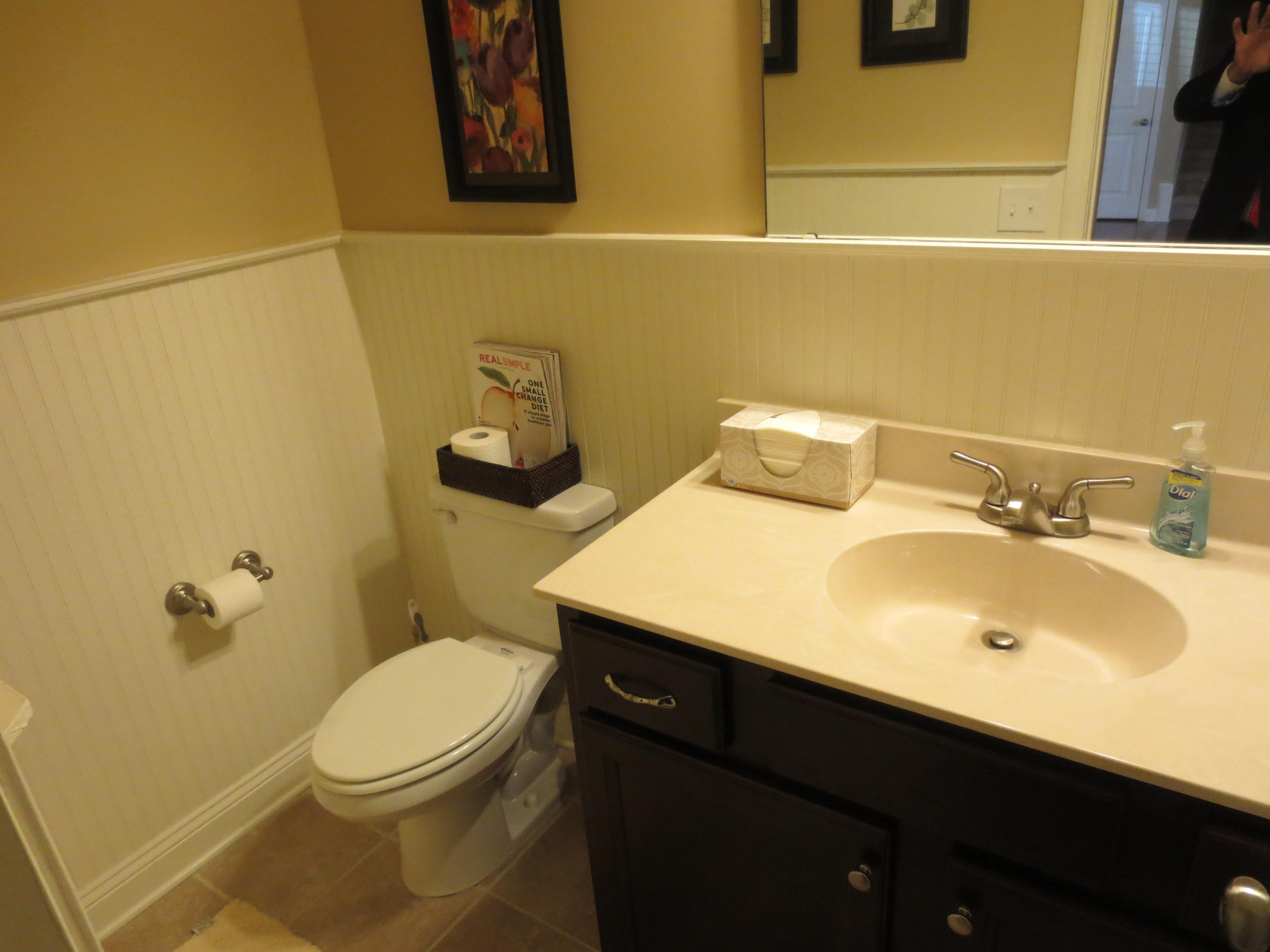 110 Queens Cove Way Whispering Pines, NC 28327 - Photo 6 of 24 Main floor half bath with bead board and tile floors