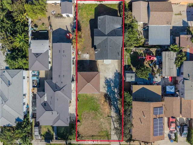 an aerial view of houses with outdoor space