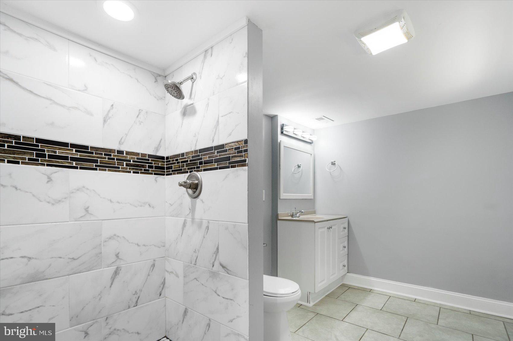 6628 Hartwait Street Baltimore, MD 21224 - Photo 23 of 31 a bathroom with a shower