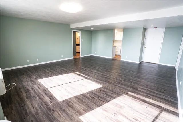 a kitchen with kitchen island a sink a stove and refrigerator