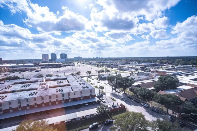 a view of a swimming pool with a patio and a yard