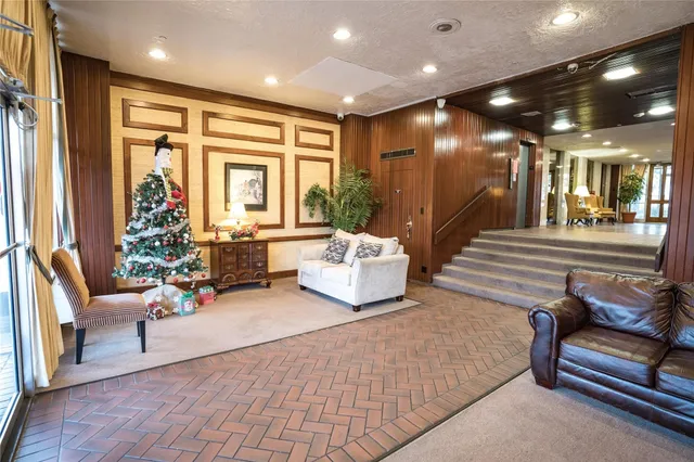 a lobby with furniture and natural light
