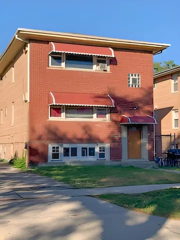 a front view of building with yard