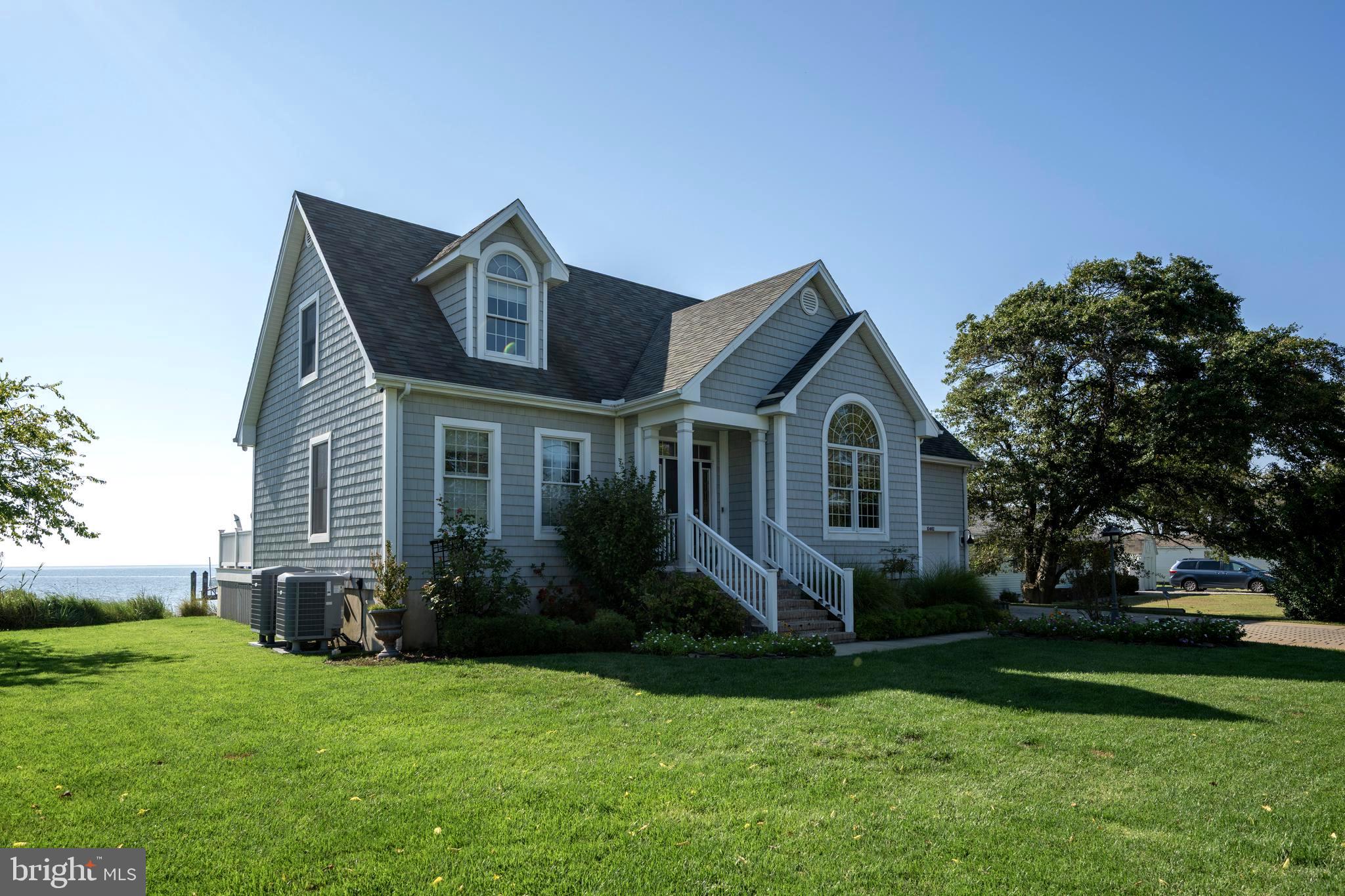 10482 Cassandra Drive Chance, MD 21821 - Photo 39 of 91 a front view of a house with a yard and garage