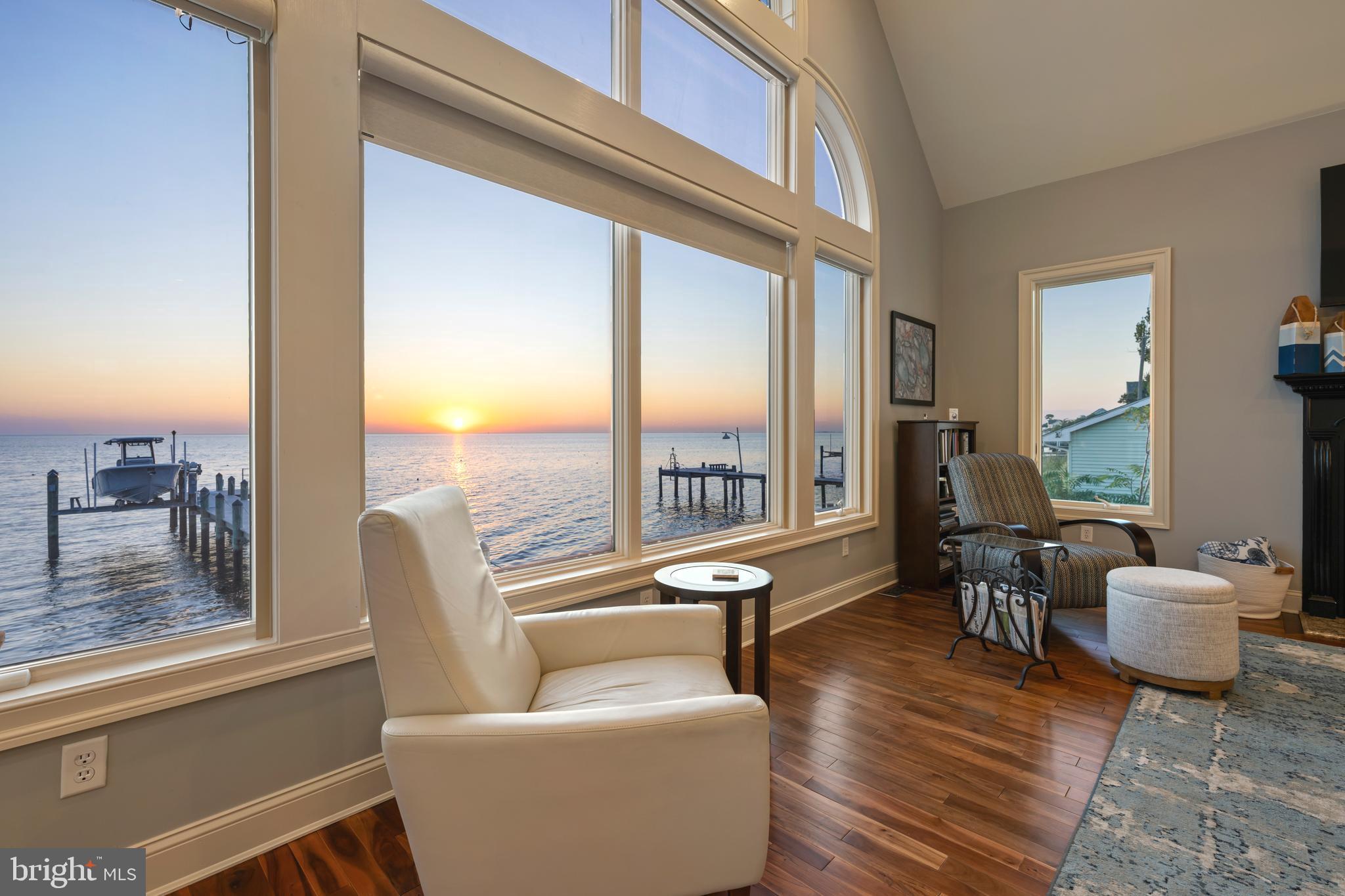 10482 Cassandra Drive Chance, MD 21821 - Photo 42 of 91 a living room with furniture and a floor to ceiling window