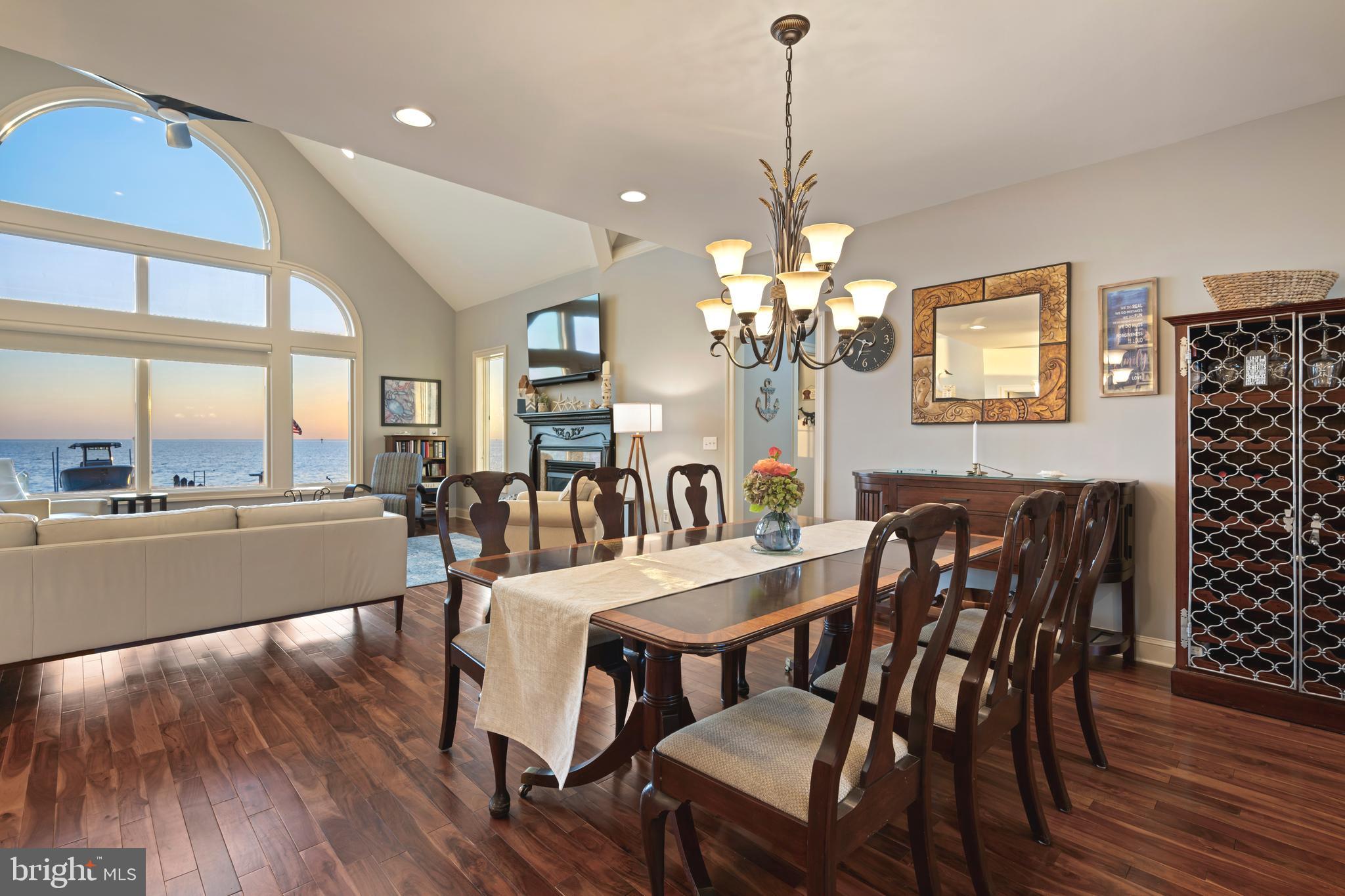 10482 Cassandra Drive Chance, MD 21821 - Photo 54 of 91 a view of a dining room with furniture wooden floor and chandelier