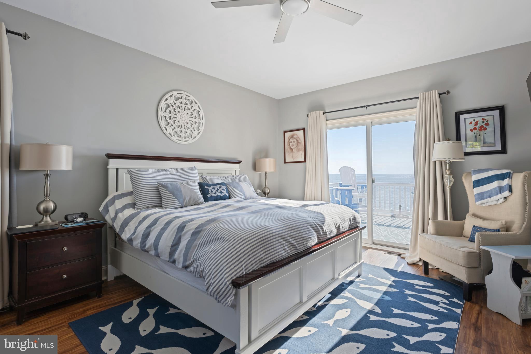 10482 Cassandra Drive Chance, MD 21821 - Photo 58 of 91 a bedroom with a bed and a lamp on table