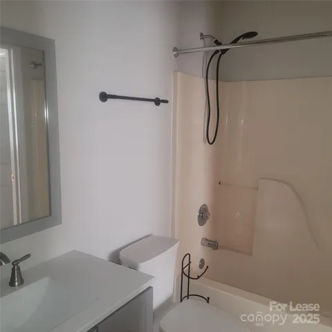a bathroom with a sink and a shower