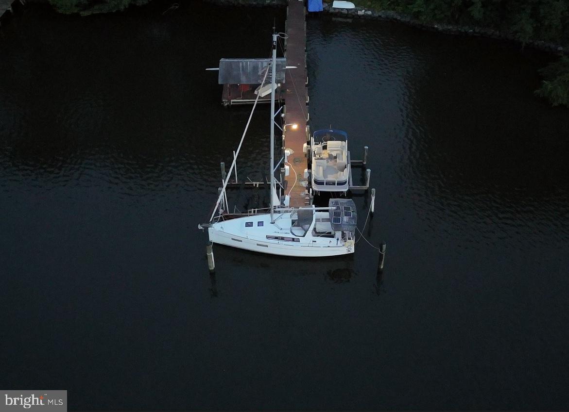 7720 West Shore Road Pasadena, MD 21122 - Photo 11 of 12 a sink sitting area with furniture and a kitchen