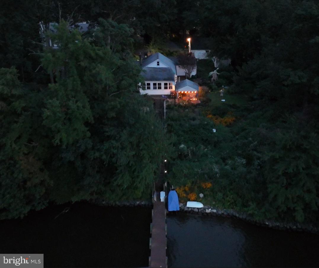 7720 West Shore Road Pasadena, MD 21122 - Photo 12 of 12 a sign that is sitting in front of a house