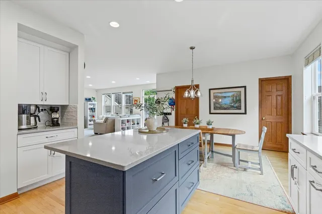 a view of kitchen island a sink and living room