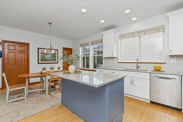 a kitchen with counter top space and dining table