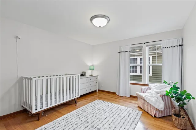 a bed room with furniture and wooden floor