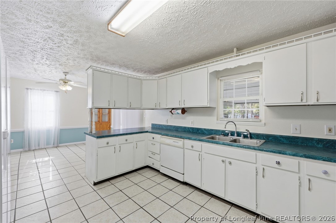 223 Broadwell Road St. Pauls, NC 28384 - Photo 11 of 28 a kitchen with a sink and cabinets