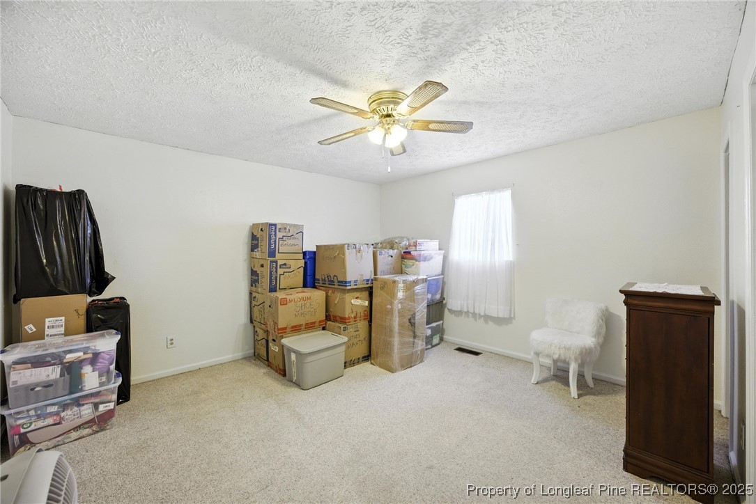 223 Broadwell Road St. Pauls, NC 28384 - Photo 12 of 28 a view of workspace with lounge chair and windows