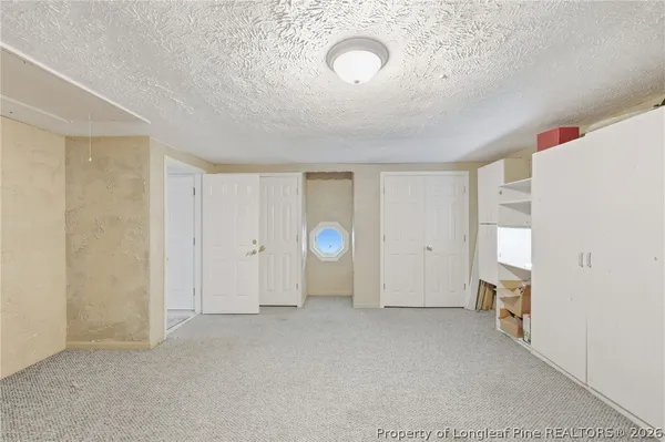 a view of a livingroom with wooden floor