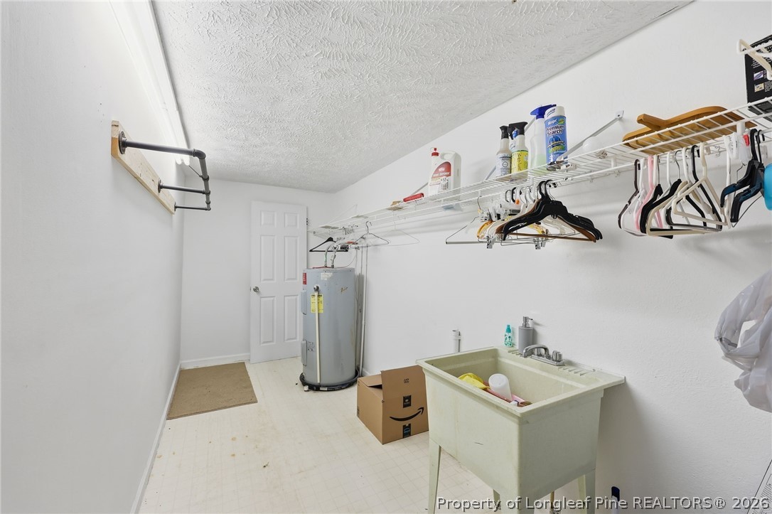 223 Broadwell Road St. Pauls, NC 28384 - Photo 14 of 28 a view of storage and utility room with two washing machine