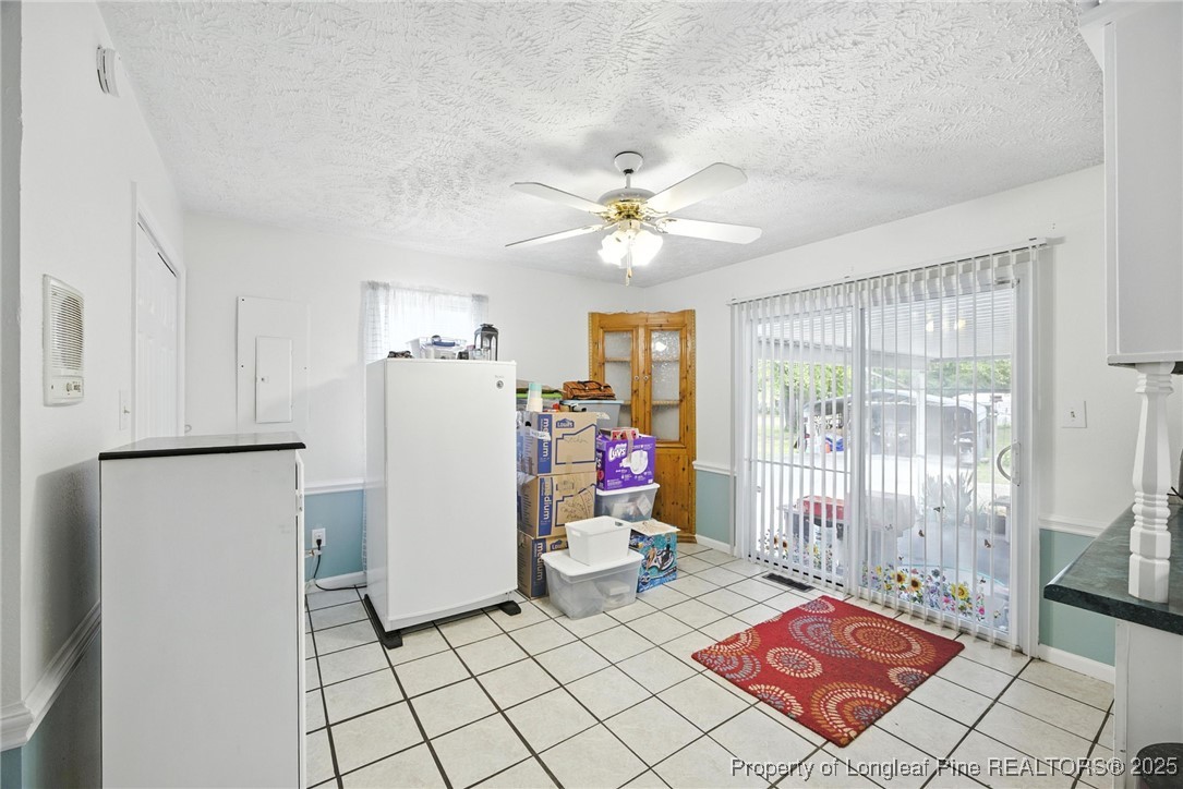 223 Broadwell Road St. Pauls, NC 28384 - Photo 14 of 28 a living room with a white furniture a rug and a window