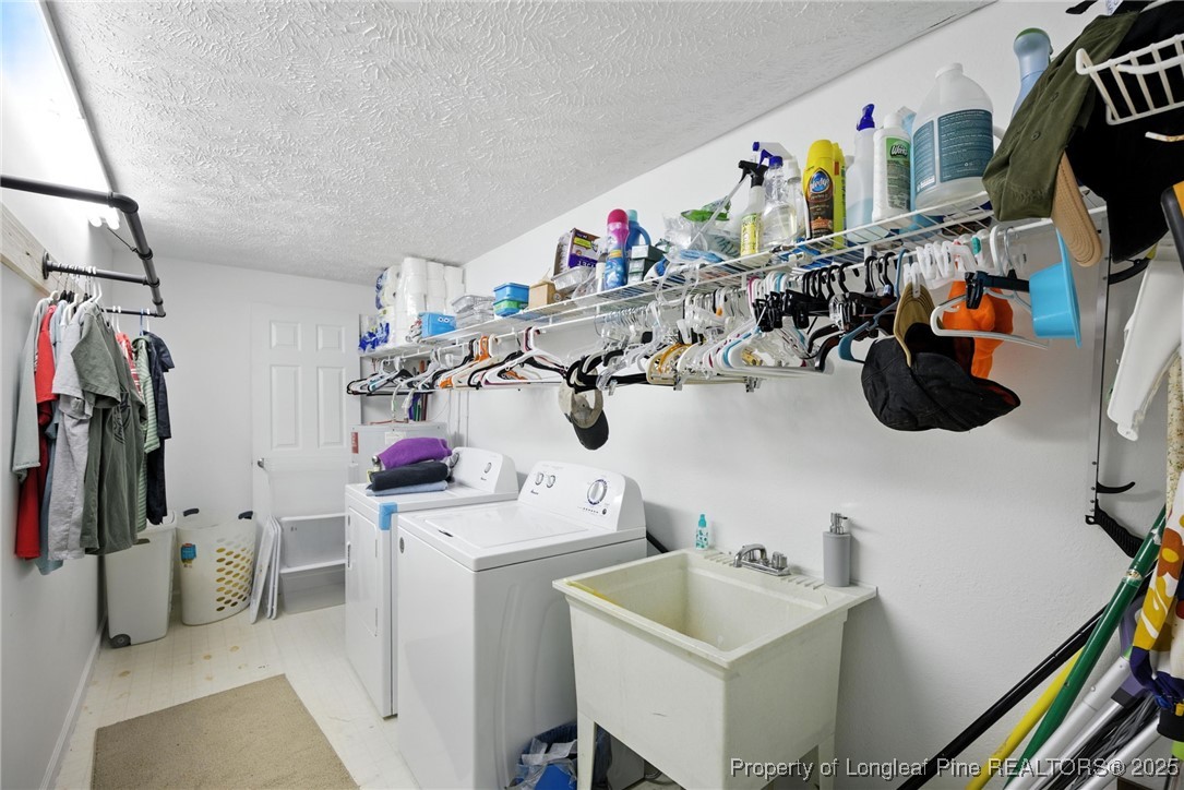 223 Broadwell Road St. Pauls, NC 28384 - Photo 20 of 28 a view of walk in closet with clothes and shoes
